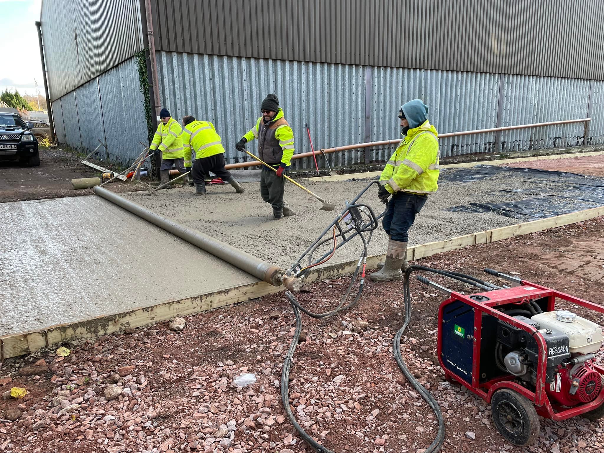 Construction safety team inspecting steel-frame build
